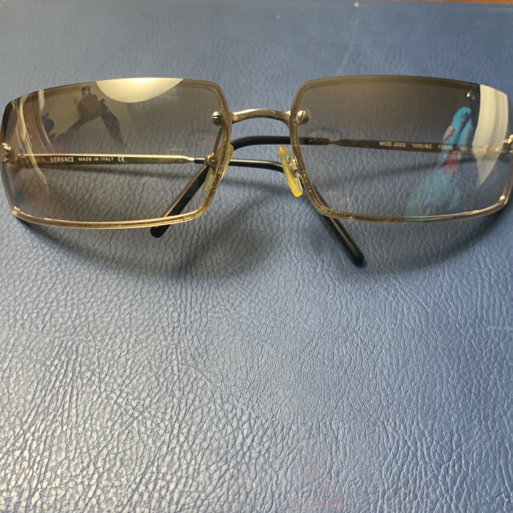 Versace sunglasses for men, no scratches, box included but has outside scratches